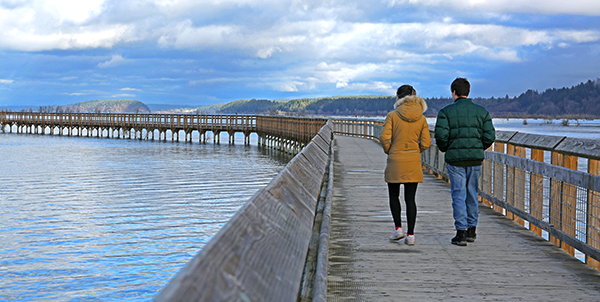 Couple walking along boardwalk